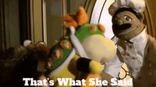 a couple of stuffed animals standing next to each other with the words that 's what she said