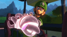 a cartoon character in a green hat is holding a ghost in his hand in a video game .