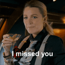 a woman holding a martini glass with the words " i missed you " next to her