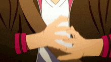 a close up of a person 's hands with a white shirt