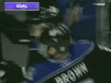 a hockey player with the number 5 on their jersey