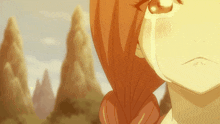 a close up of a girl 's face with a mountain in the background