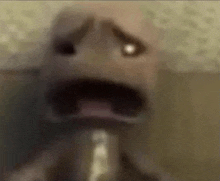 a close up of a person 's face with a very scary look on it .