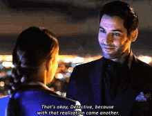 a man and a woman are looking at each other and the man says that 's okay