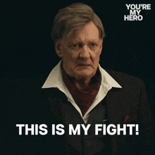 a man with a scarf around his neck says this is my fight
