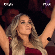 a woman with her arms in the air is on a citytv advertisement