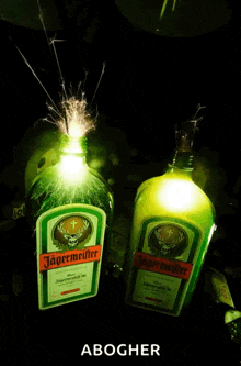 two bottles of jagermeister with sparklers behind them