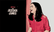 a woman in a red shirt is laughing in front of a sign that says netflix .