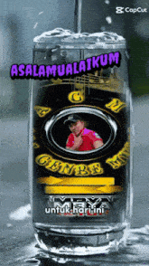 a glass with a picture of a man and the words " selamat alaikum "