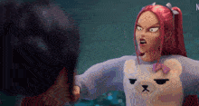 a girl with red hair is wearing a teddy bear sweater with a bow on it