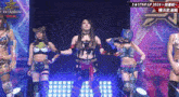 a group of women standing on a stage with a sign that says stardom