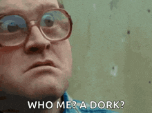 a man wearing glasses and a blue shirt says who me a dork