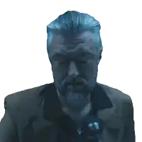 a man with a beard is speaking into a microphone with his eyes closed