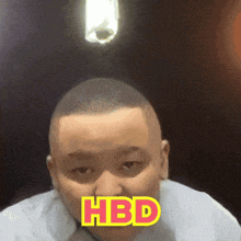a man 's face is shown with the words hbd written on it