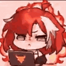 a red haired anime girl is sitting in front of a laptop computer .