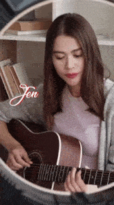 a woman is playing a guitar and the name jen is on the bottom