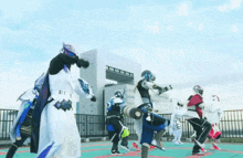 a group of people in costumes are dancing in front of a building with the number 1 on it