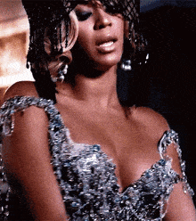 a close up of a woman wearing a very revealing dress
