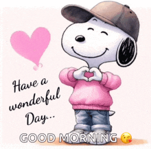 a picture of snoopy making a heart with his hands and the words have a wonderful day good morning