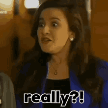 a woman is making a funny face and saying really ?
