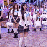 a girl in a plaid skirt has a name tag on her shirt that says ' a ' on it