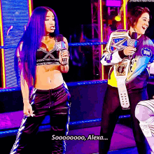 a woman with purple hair is holding a microphone while another woman holds a championship belt and says alexa