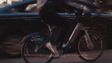 Ford GIF - Riding A Bike Bicycle GIFs