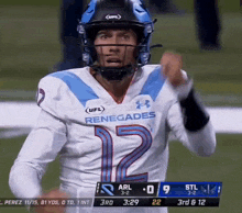 a football player wearing a renegades jersey is pointing