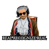 a man wearing headphones and a scarf with the words " real recognize real " on the bottom