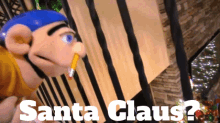 a stuffed animal with a pencil in its mouth and the words santa claus below it