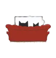 two black cats laying on a red couch with a purple blanket