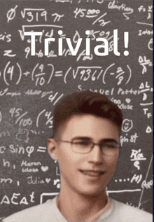 a man wearing glasses stands in front of a blackboard that says trivial on it