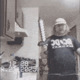a man in an ac dc shirt holds a sword