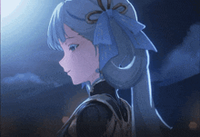 a girl with a blue bow in her hair looks down
