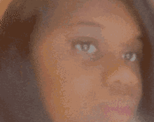 a close up of a woman 's face shows her eyes