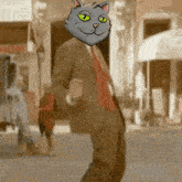 a man in a suit and tie with a cat head on his head