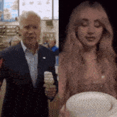 a man in a suit is holding an ice cream cone next to a woman