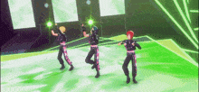 three anime characters are dancing on a stage in front of a green background .