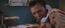 a bloody man talking on a phone with the words my mom and dad are gonna be soooooo mad at meee