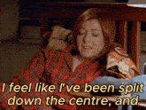 a woman sits in a chair with her eyes closed and says i feel like i 've been spit down the centre