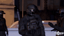 a man in a polizei uniform stands next to another man