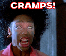 a woman is making a funny face with the words cramps written above her