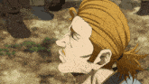 a close up of a man 's face with sweat coming out of his mouth