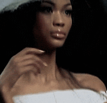 a close up of a woman 's face with a hat on