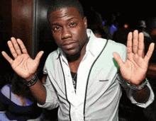 a man in a white shirt with the word dsquared on the front