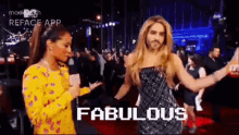 a man in a wig is dancing with a woman on a red carpet and the words fabulous are on the screen .