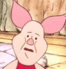 a close up of a pig from winnie the pooh with a sad face .