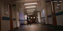 a man is walking down a hospital hallway with a sign that says pranay varma