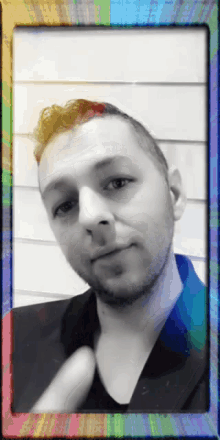 a black and white photo of a man with a colorful frame around him