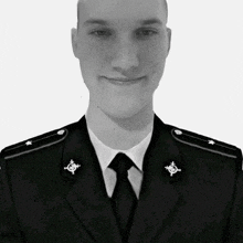 a man in a military uniform has a badge on his shoulder that says ' a ' on it